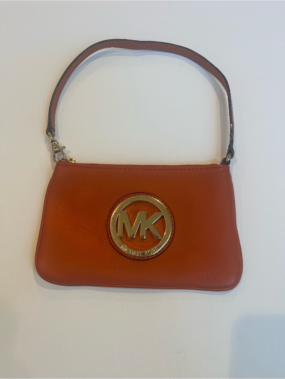 Michael Kors Orange Leather wristlet with Gold MK Emblem